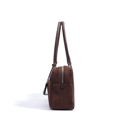 Brown leather bag with a zipper on a white background